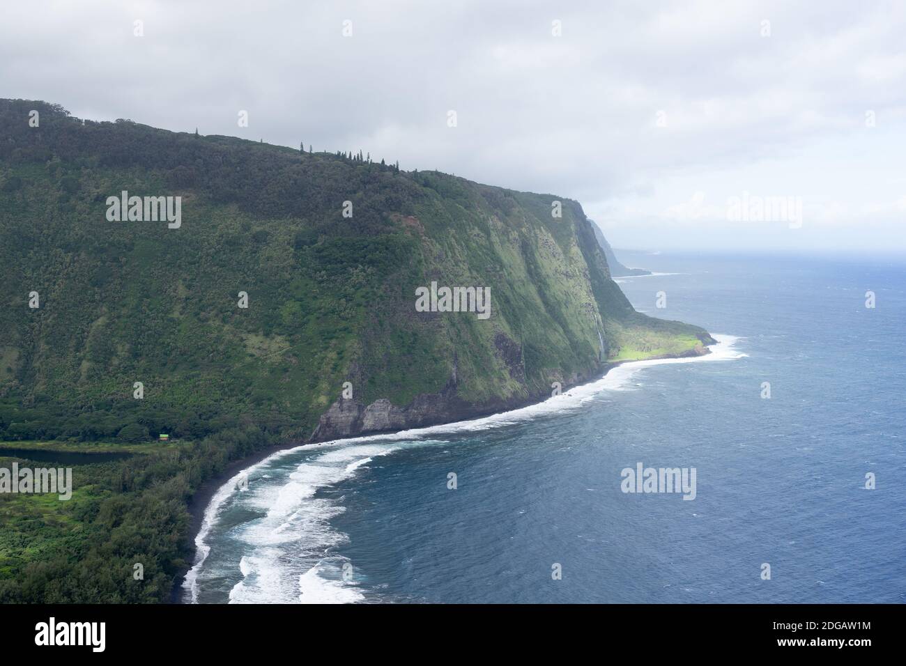 Waipio valley with coast and cliffs, viewed from above on a cloudy day - Hawaii island, Hawaii, USA Stock Photo