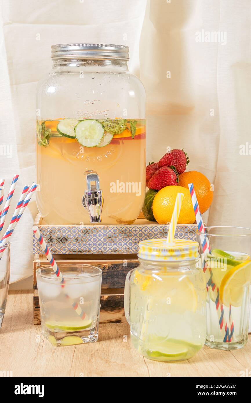 fruit punch in a drink dispenser at a party Stock Photo - Alamy