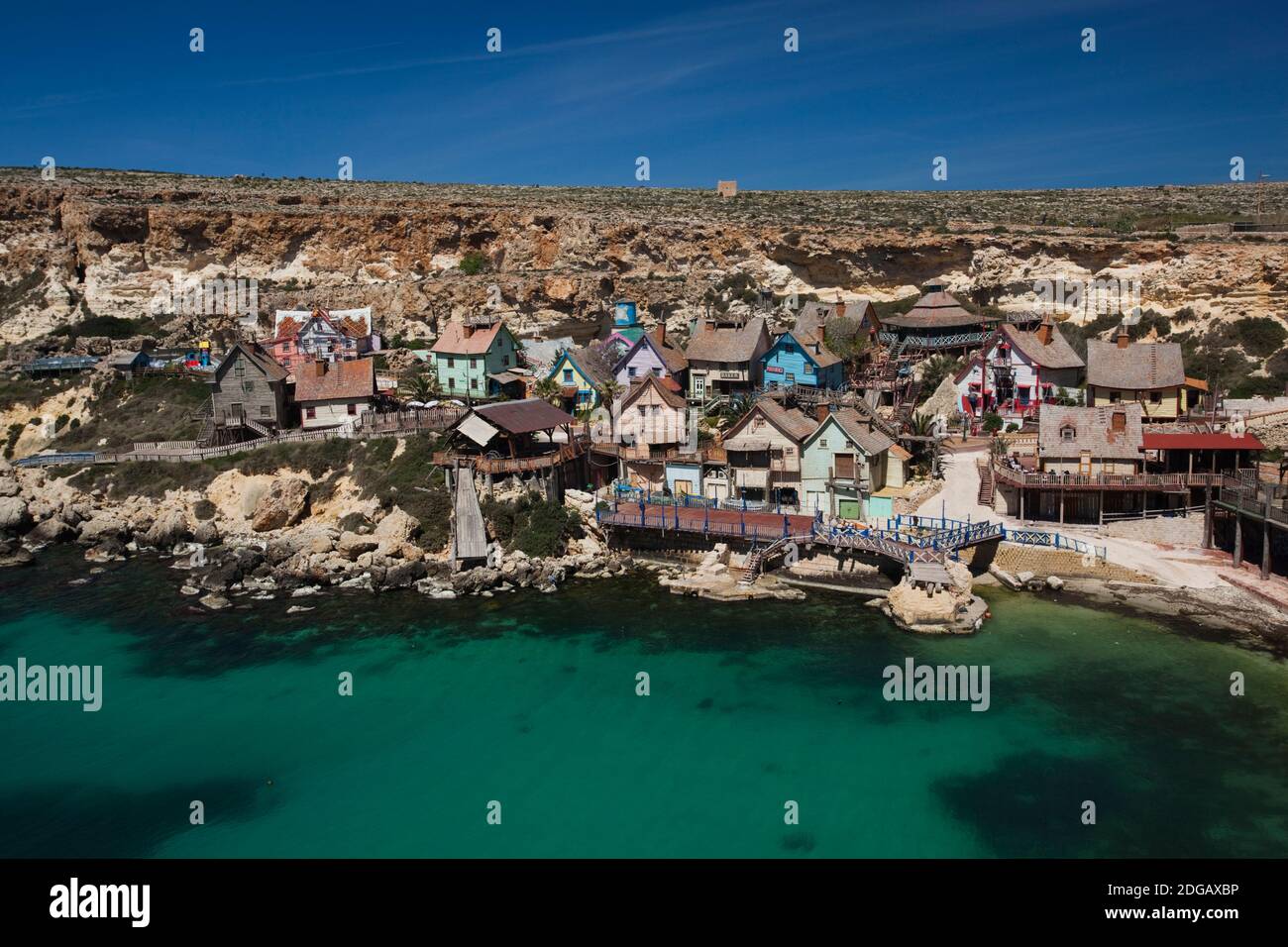 Village at the waterfront, Popeye Village, Anchor Bay, Malta Stock Photo