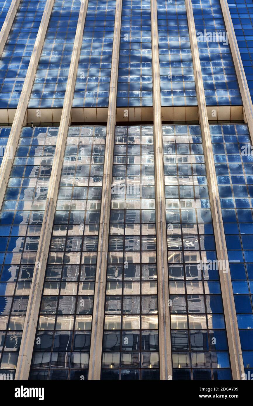 The reflex of the skyscraper in the window Stock Photo