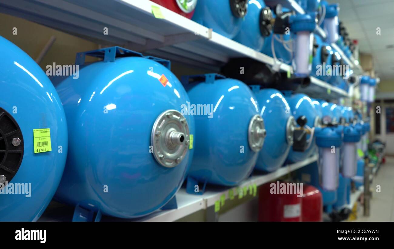 Shelf With Hydroaccumulators In The Store Blue Color Battery Water Tank Automatic Water Supply Station Application For A Private House Stock Photo Alamy