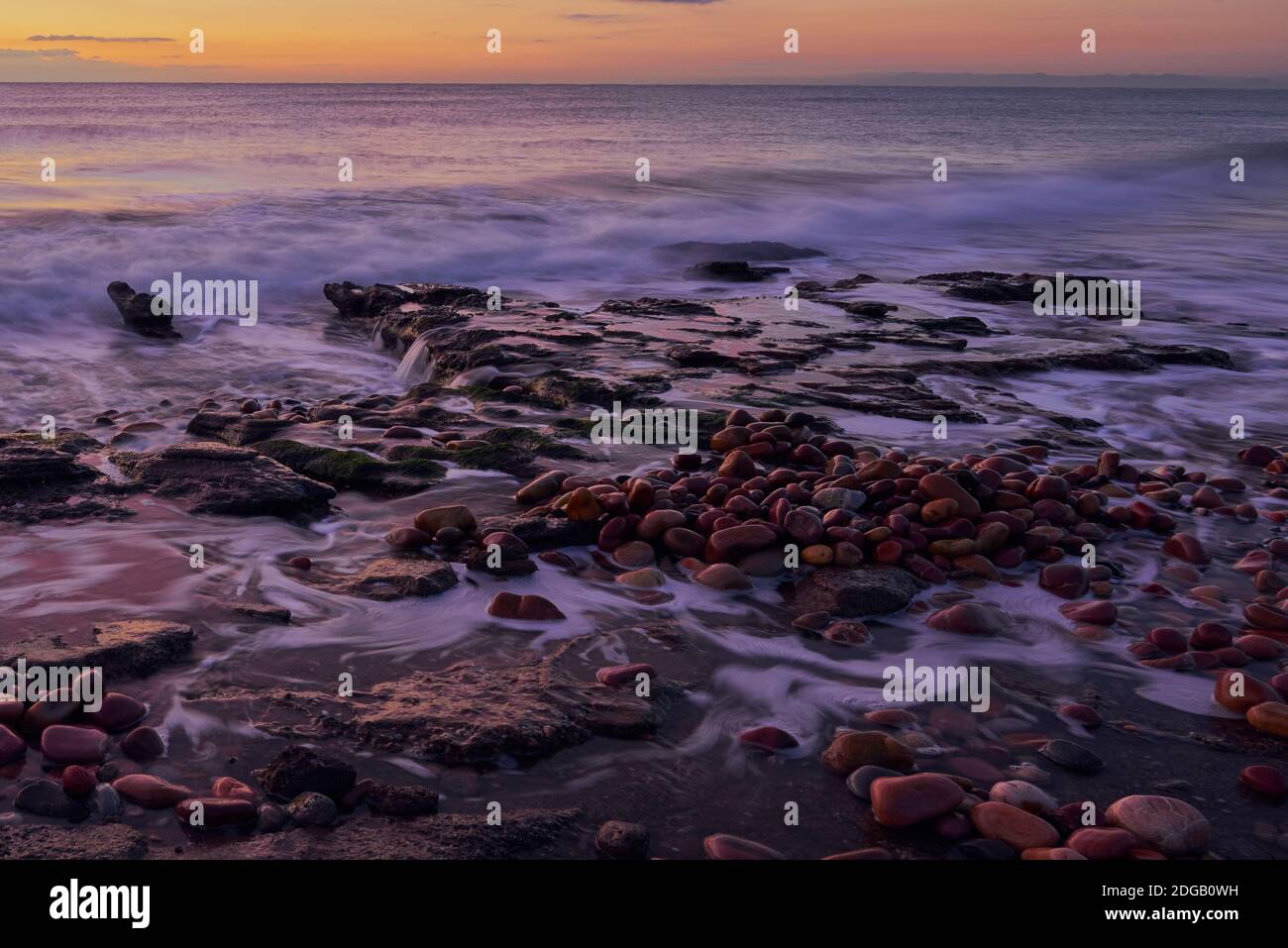 Light Beach Rocks Sunrise on beach in slow hi-res stock photography and images - Alamy