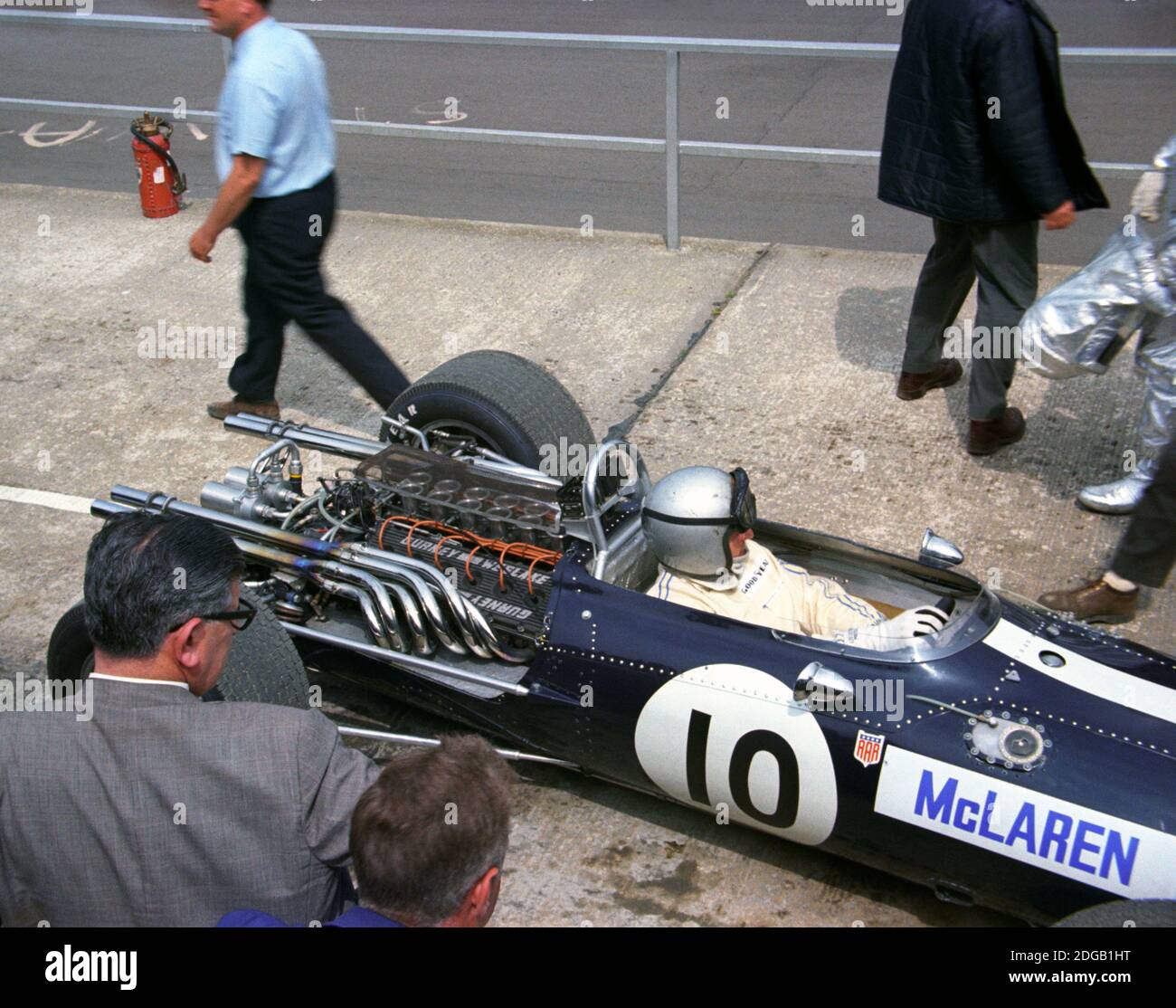Bruce McLaren in his Eagle-Weslake V12 Formula 1 car arriving at the pits at Silverstone for the 1967 British Grand Prix Practise day, 14th July Stock Photo