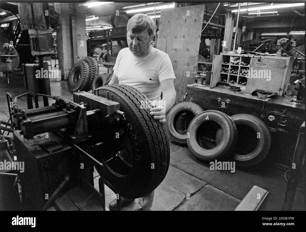 Workers at the General Tire Company in Akron, Ohio, work the final production shift for making passengers tires before the factory closed for good on August 20, 1982. More than 800 production workers lost their jobs. General Tire had been the last company to make tires in northeast Ohio city, after Goodyear, B.F. Goodrich and Firestone made cuts. Akron had been known as the Rubber Capital of the World. Ernie Mastroianni photo. Stock Photo