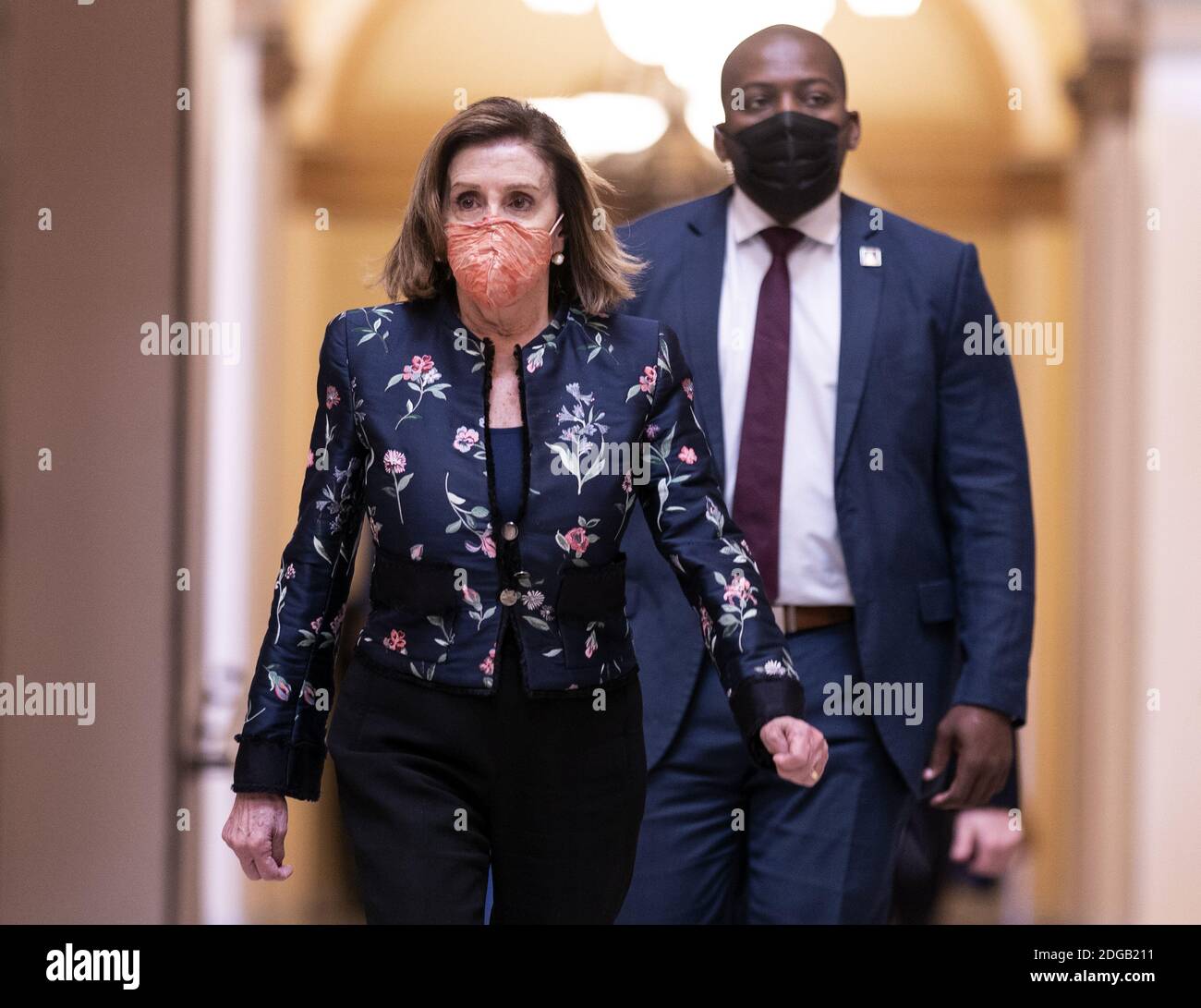 Washington, United States. 08th Dec, 2020. Speaker of the House Nancy Pelosi, D-Calif., leaves the House Chambers as lawmakers continue debate on the next COVID-19 stimulus package, at the U.S. Capitol in Washington, DC on Tuesday, December 8, 2020. Photo by Kevin Dietsch/UPI Credit: UPI/Alamy Live News Stock Photo