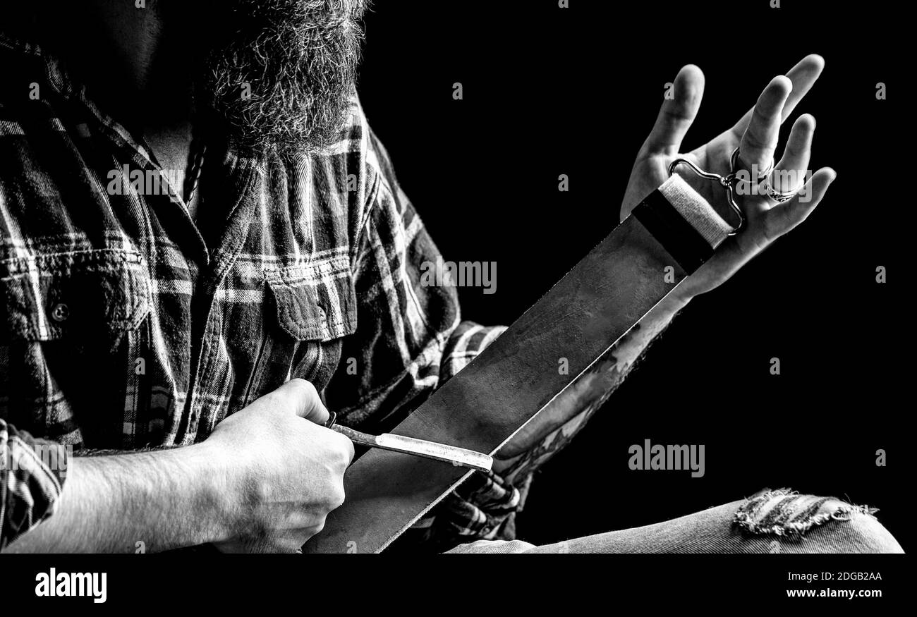 Straight razor. Vintage tools for barbers, razor, sharpen the blade in
