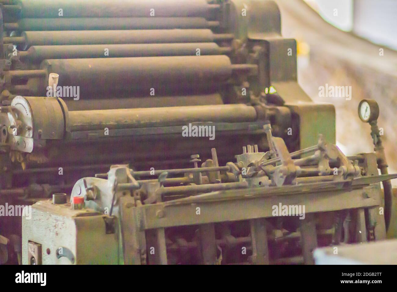 An old printing press machine with rotary equipments. Close up detail