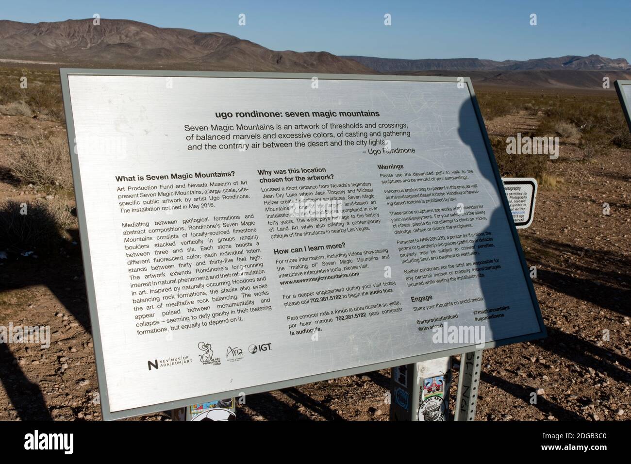 A sign describes Seven Magic Mountains, an artwork of limestone