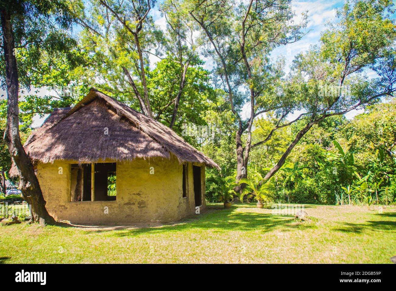 Earthen house under shade of trees. An earth house, also known as earth