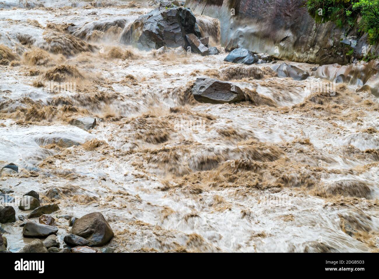 Muddy water flow rapidly in Urubamba River at Aguas Calientes Stock Photo