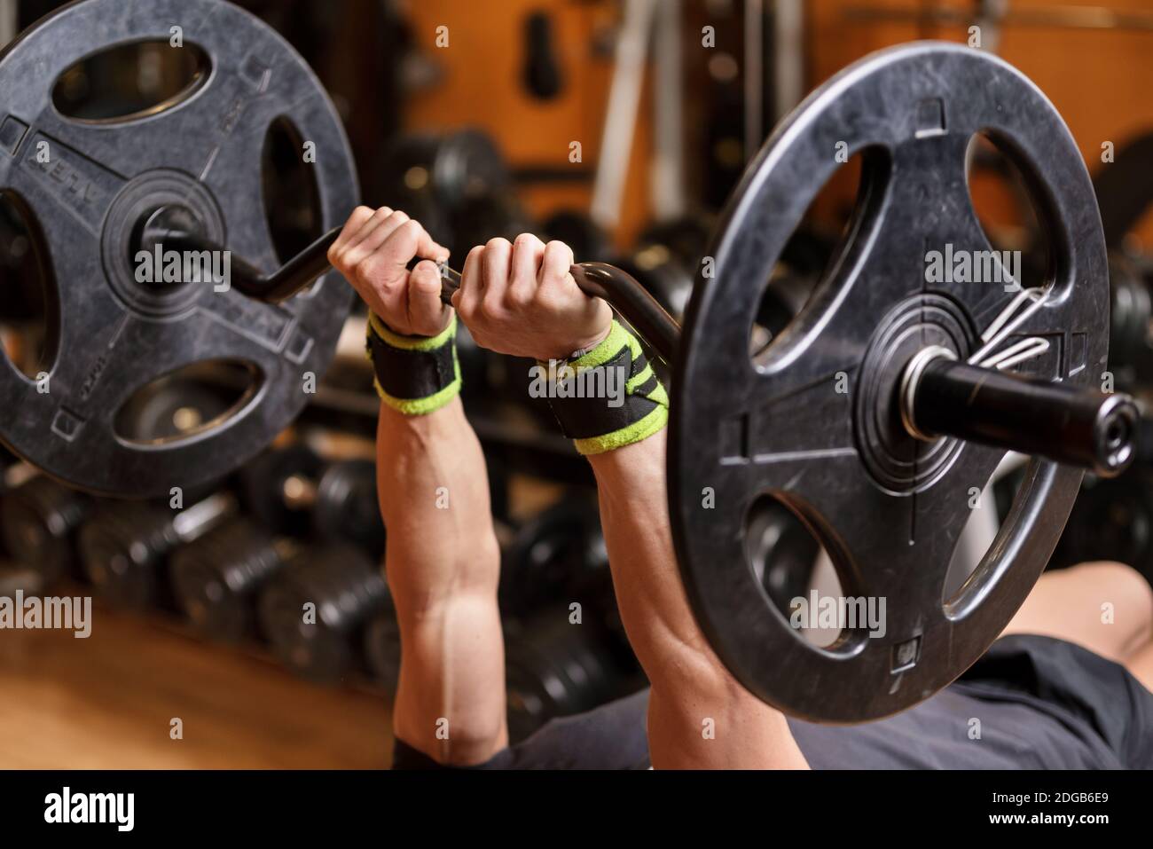 Handsome young muscular man close up, doing bench french press workout with  barbell in gym Stock Photo - Alamy