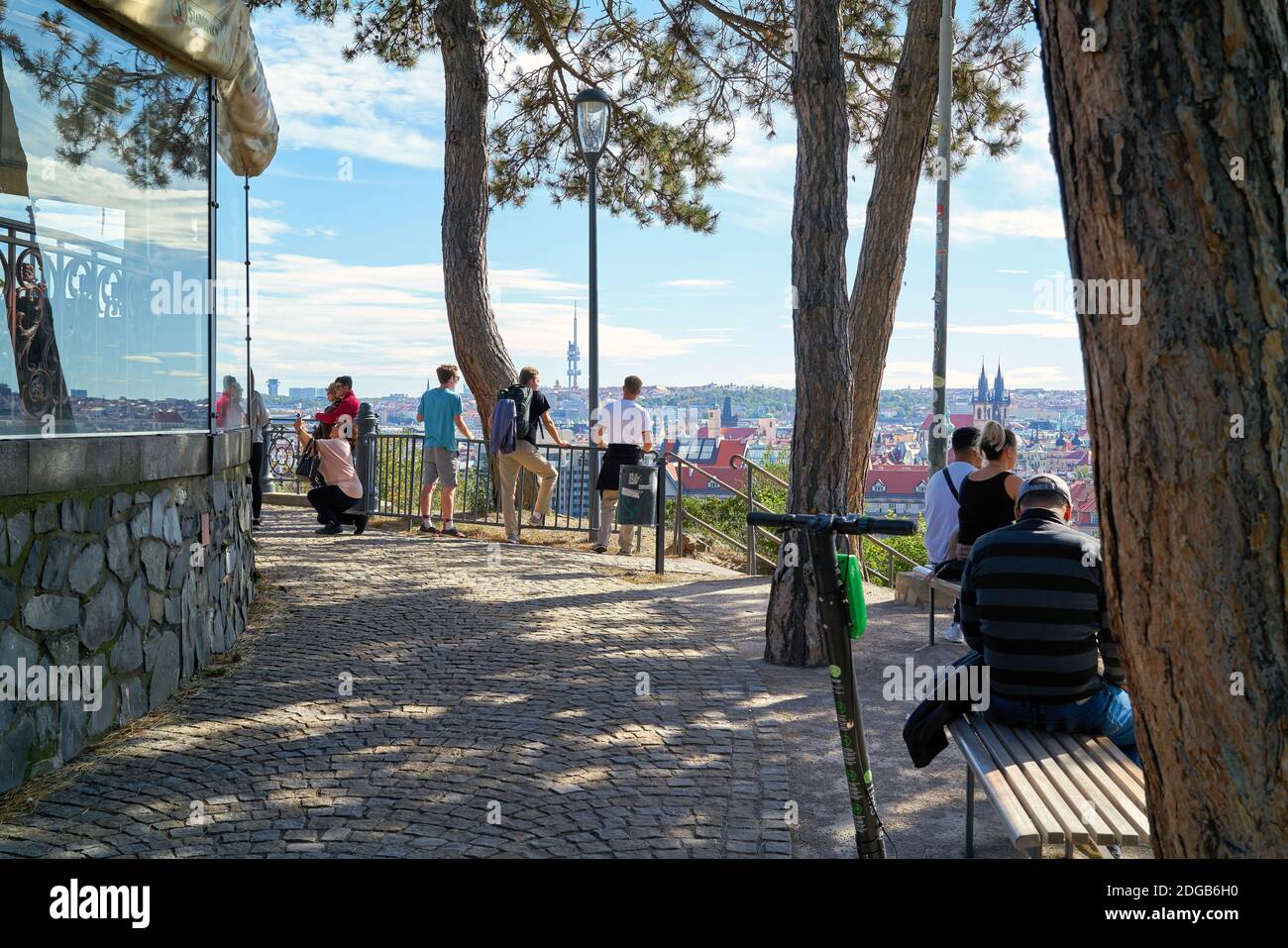 Tourists at the viewpoint at the Hanavsky Pavilion in Letna Park with a view of the Old Town of Prague Stock Photo