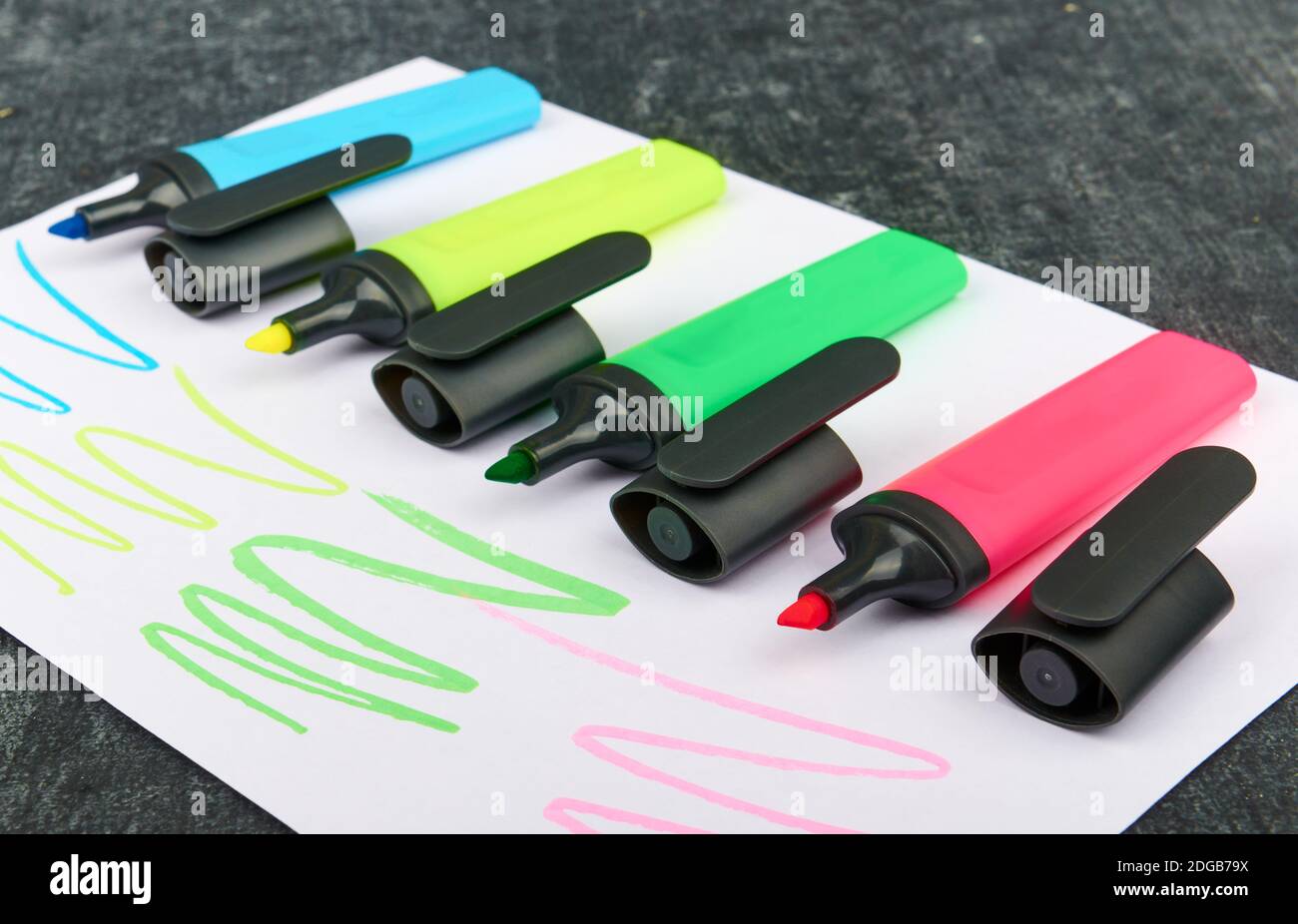 Multi-colored felt-tip pens on a sheet of paper, close up, shallow depth of sharpness Stock Photo
