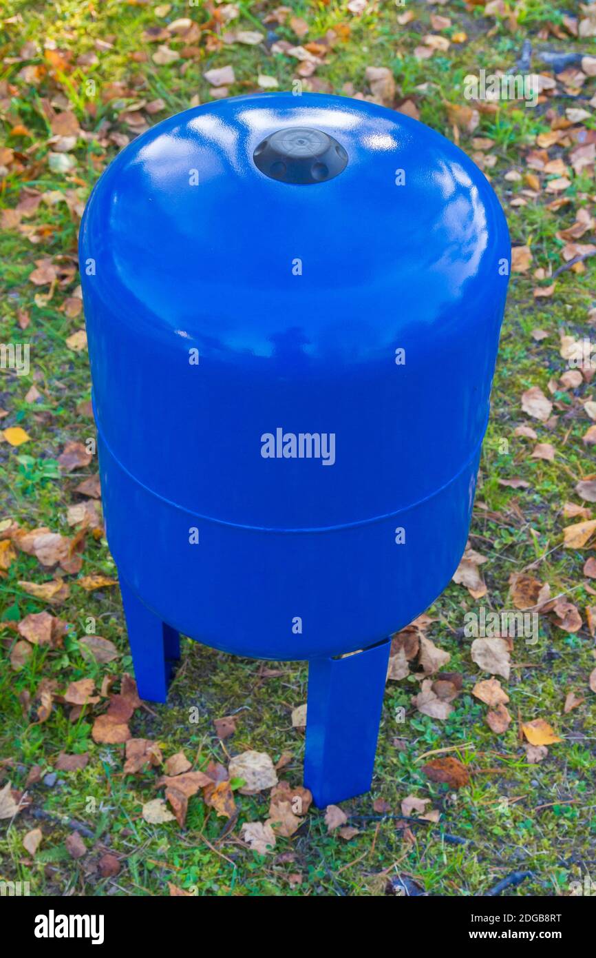 Blue metal water tank for 50 liters of water Stock Photo - Alamy