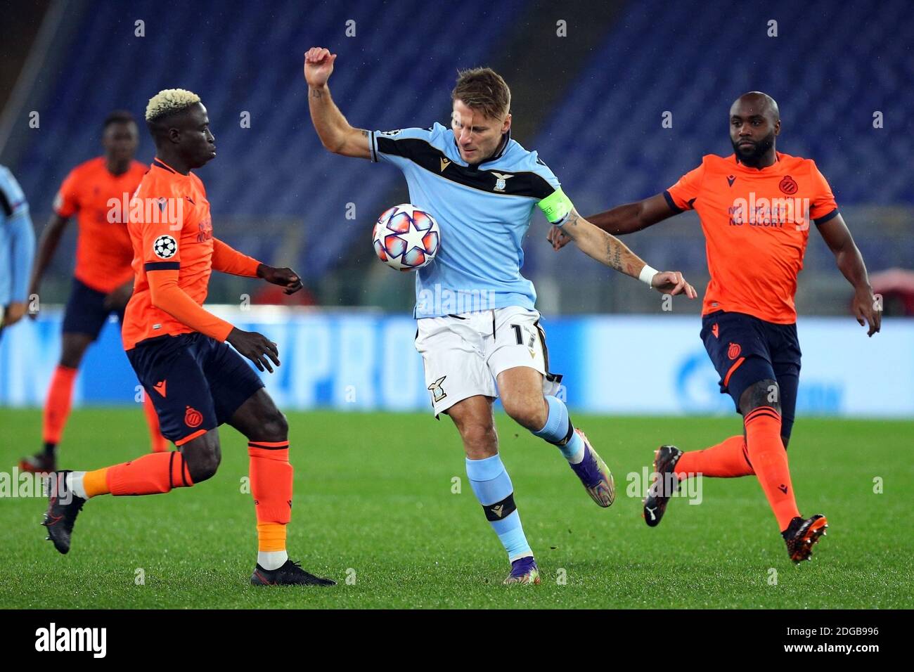 Rome, Italy. 08th Dec, 2020. Ciro Immobile of Lazio (C) fights for the ball with Krepin Diatta (L) and Eder Balanta (R) of Club Brugge during the UEFA Champions League, Group F football match between SS Lazio and Club Brugge KV on December 8, 2020 at Stadio Olimpico in Rome, Italy - Photo Federico Proietti/DPPI/LM Credit: Gruppo Editoriale LiveMedia/Alamy Live News Stock Photo