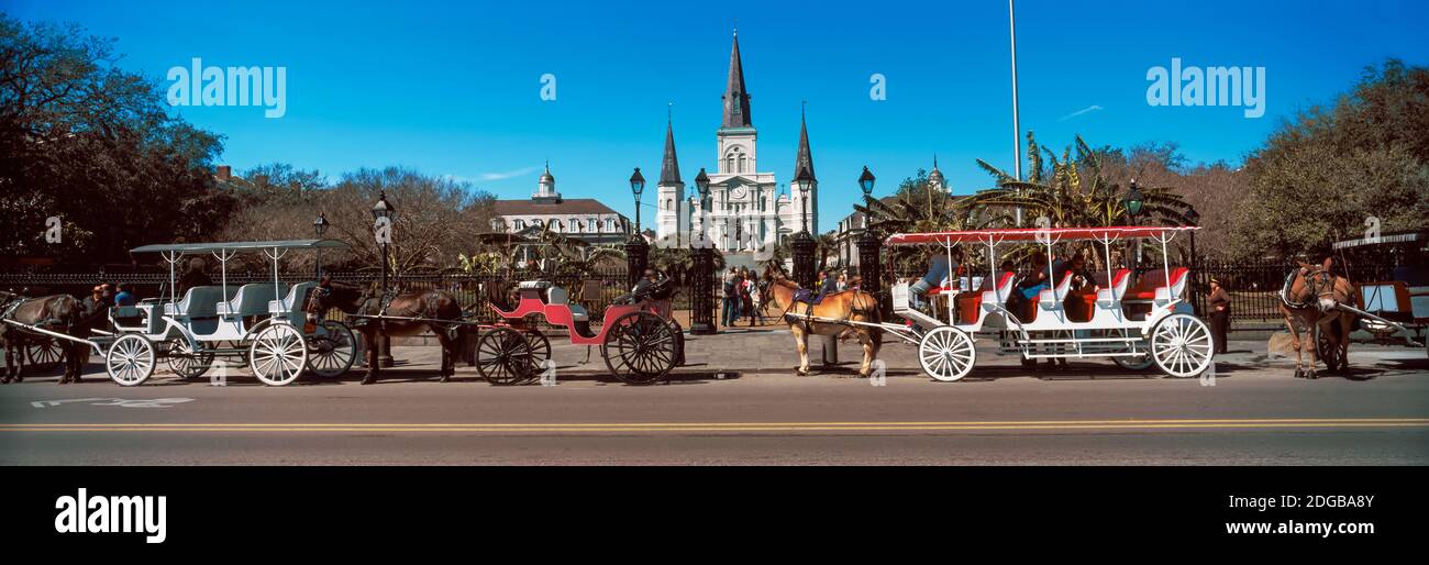 Horsedrawn carriages on the road with St. Louis Cathedral in the background, Jackson Square, New Orleans, Louisiana, USA Stock Photo