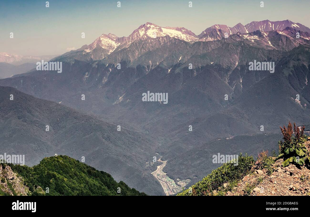 Mountain landscape with snow on the mountain tops. Stock Photo
