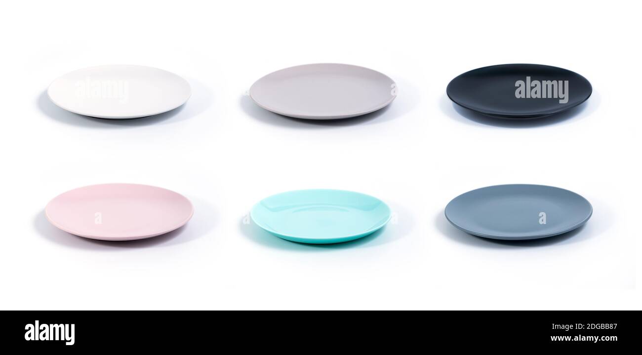 Set of six colorful empty plates isolated on white background side view ...