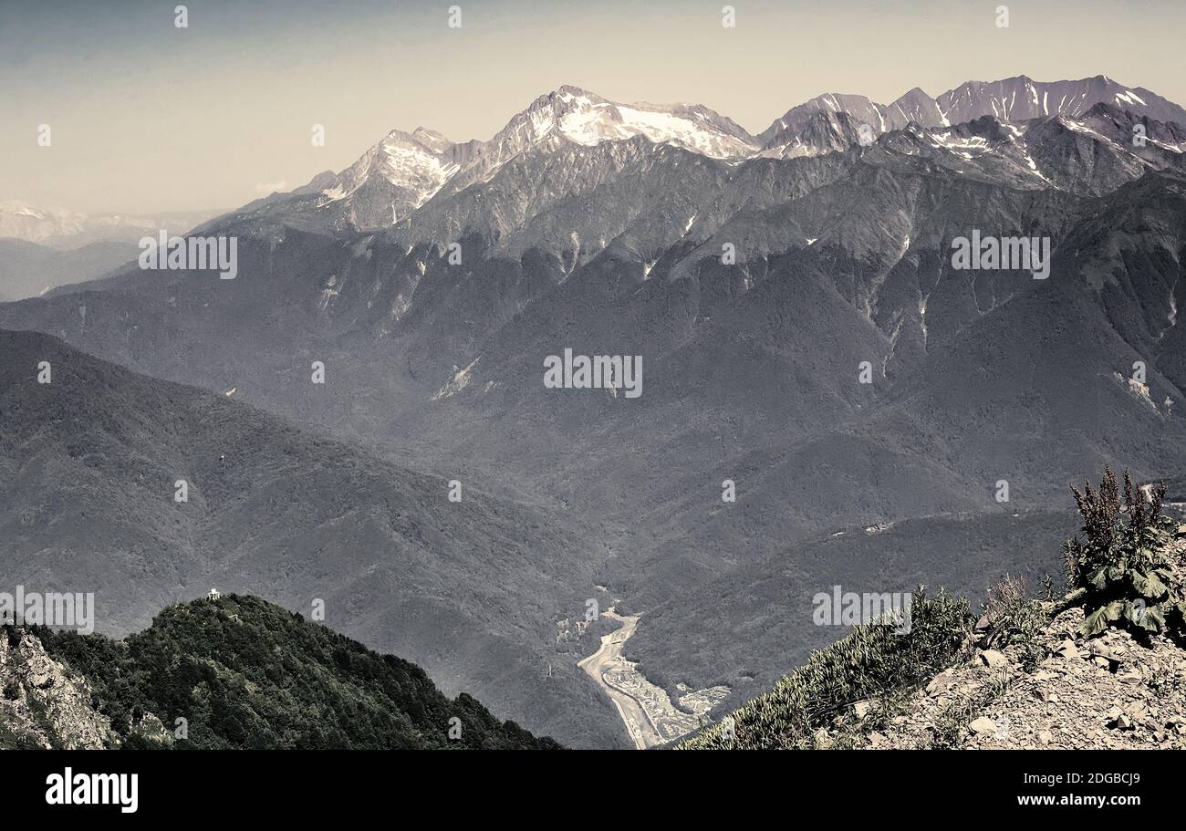 Mountain landscape with snow on the mountain tops. Stock Photo
