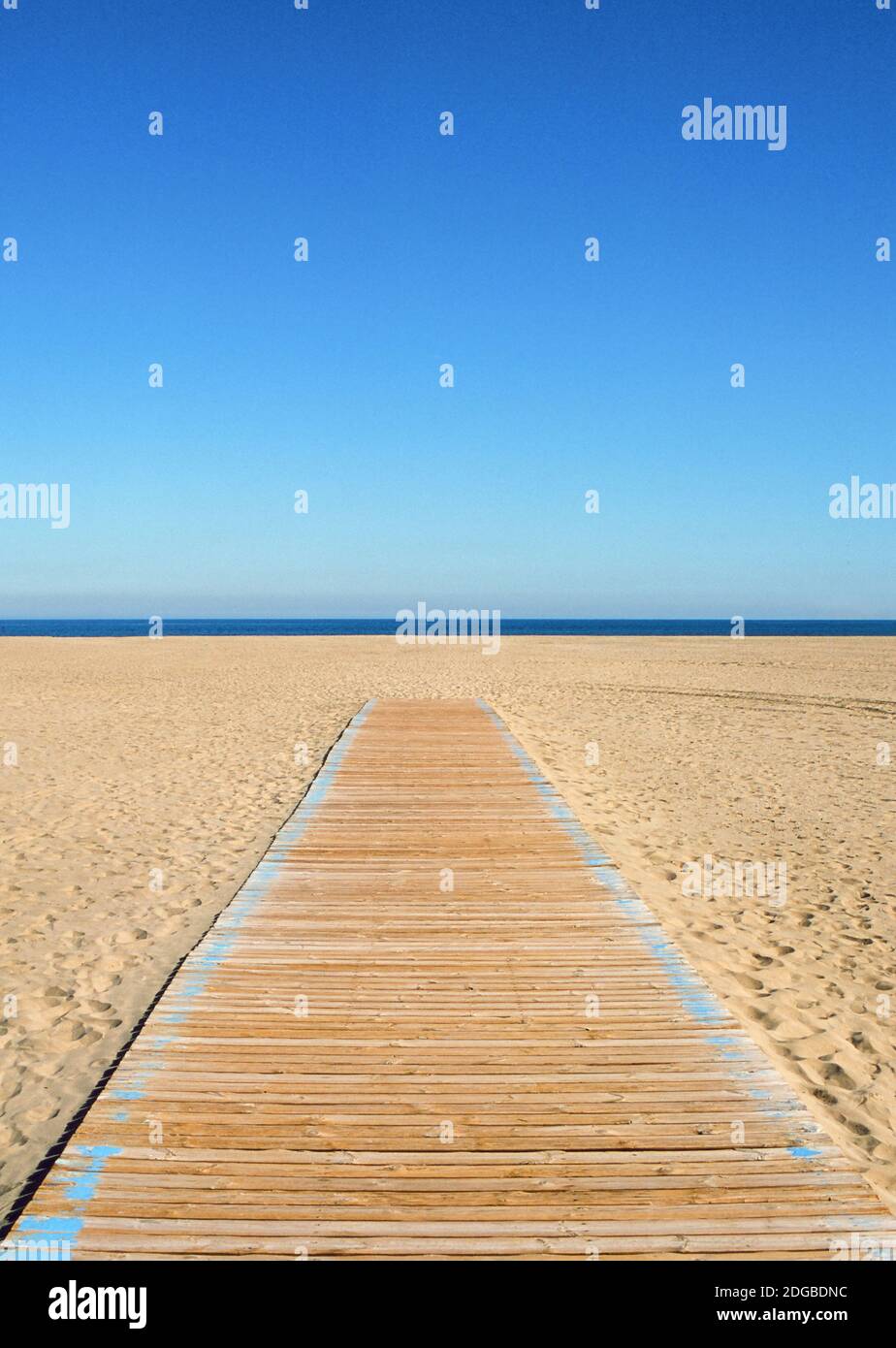 Empty beach and wooden path Stock Photo