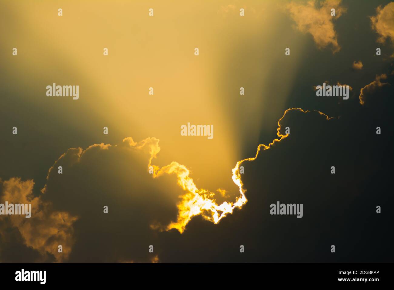 Sun shines through the clouds and the sky shines in beautiful light ...
