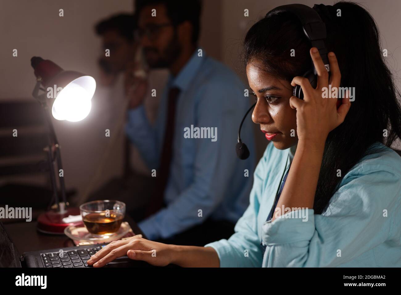 An Indian Bengali young woman/telecaller in office wear is