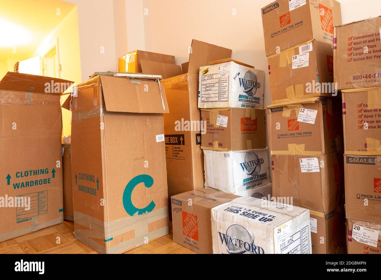Stacks of cardboard moving boxes overwhelm a small New York City apartment, USA Stock Photo Alamy