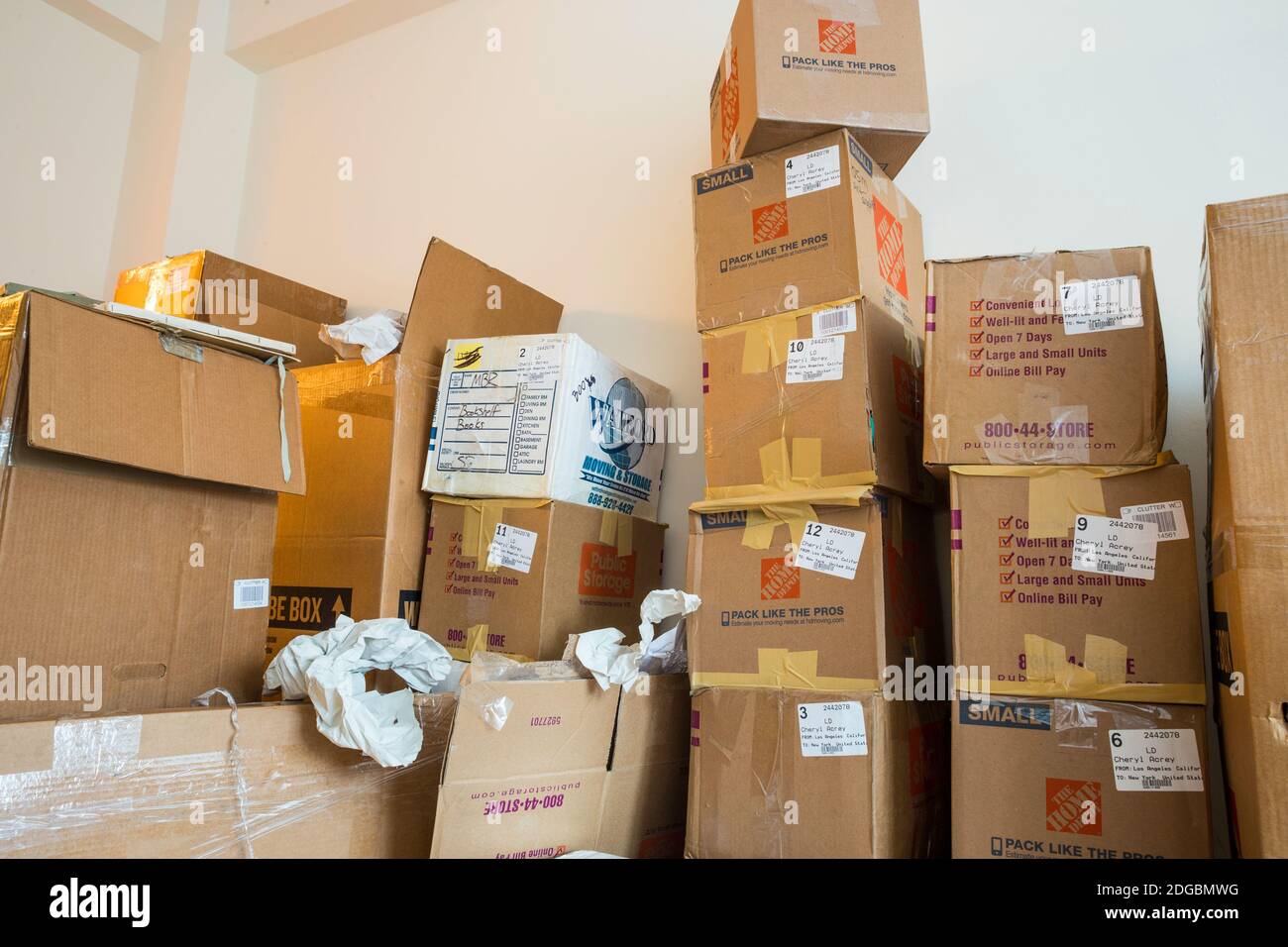 Stacks of cardboard moving boxes overwhelm a small New York City apartment, USA Stock Photo