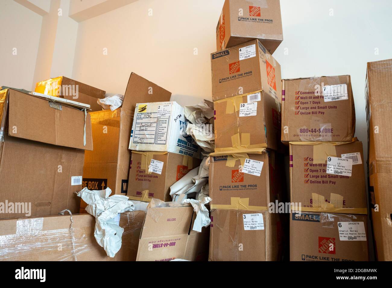 Stacks of cardboard moving boxes overwhelm a small New York City