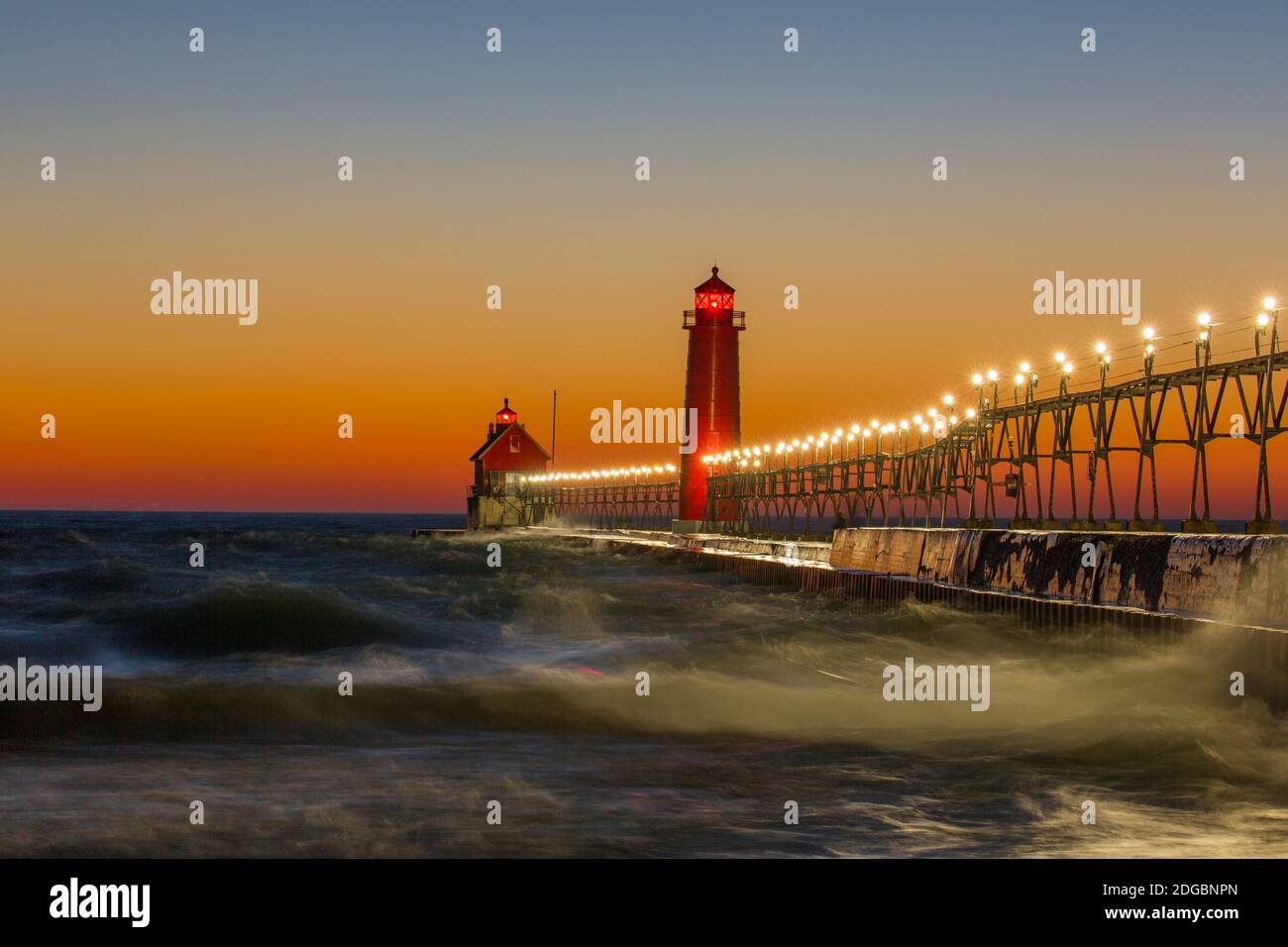 Lighthouse on the jetty at dusk, Grand Haven South Pierhead Inner Lighthouse, Lake Michigan, Grand Haven, Ottawa County, Michigan, USA Stock Photo