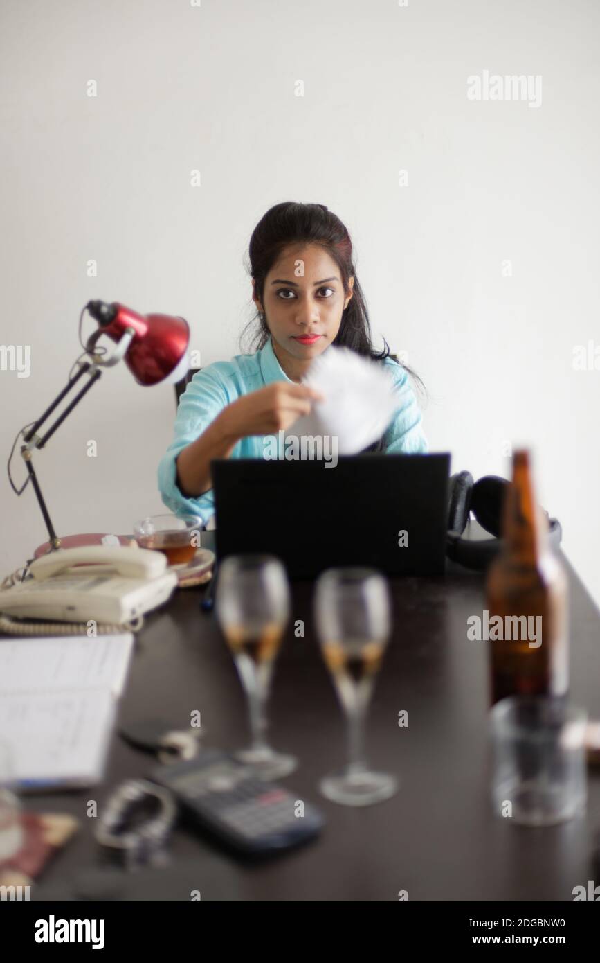 Indian Bengali attractive young woman in office wear enjoying