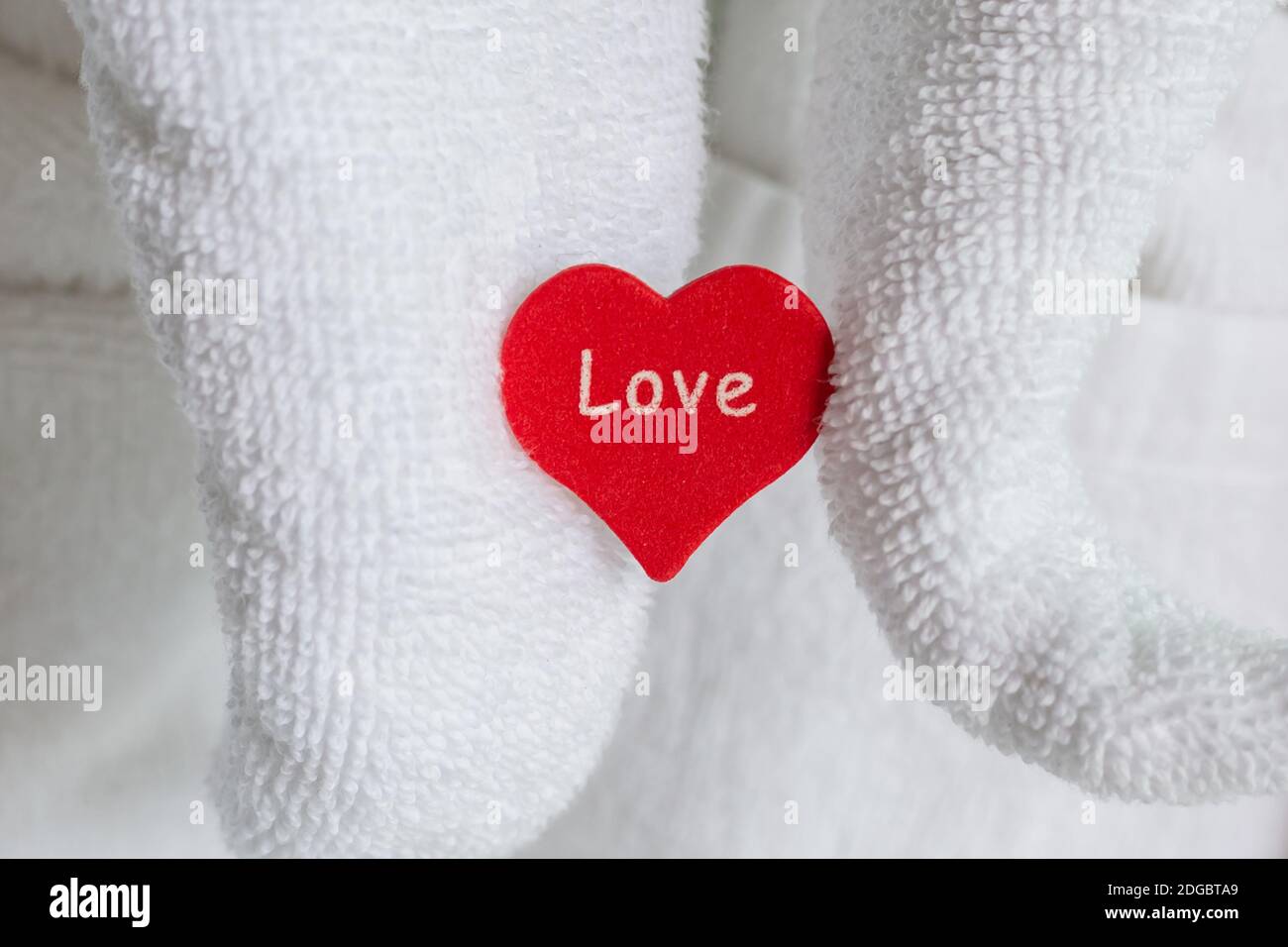 Figure of a towel elephant icon heart greeting guests newlyweds in a hotel Stock Photo