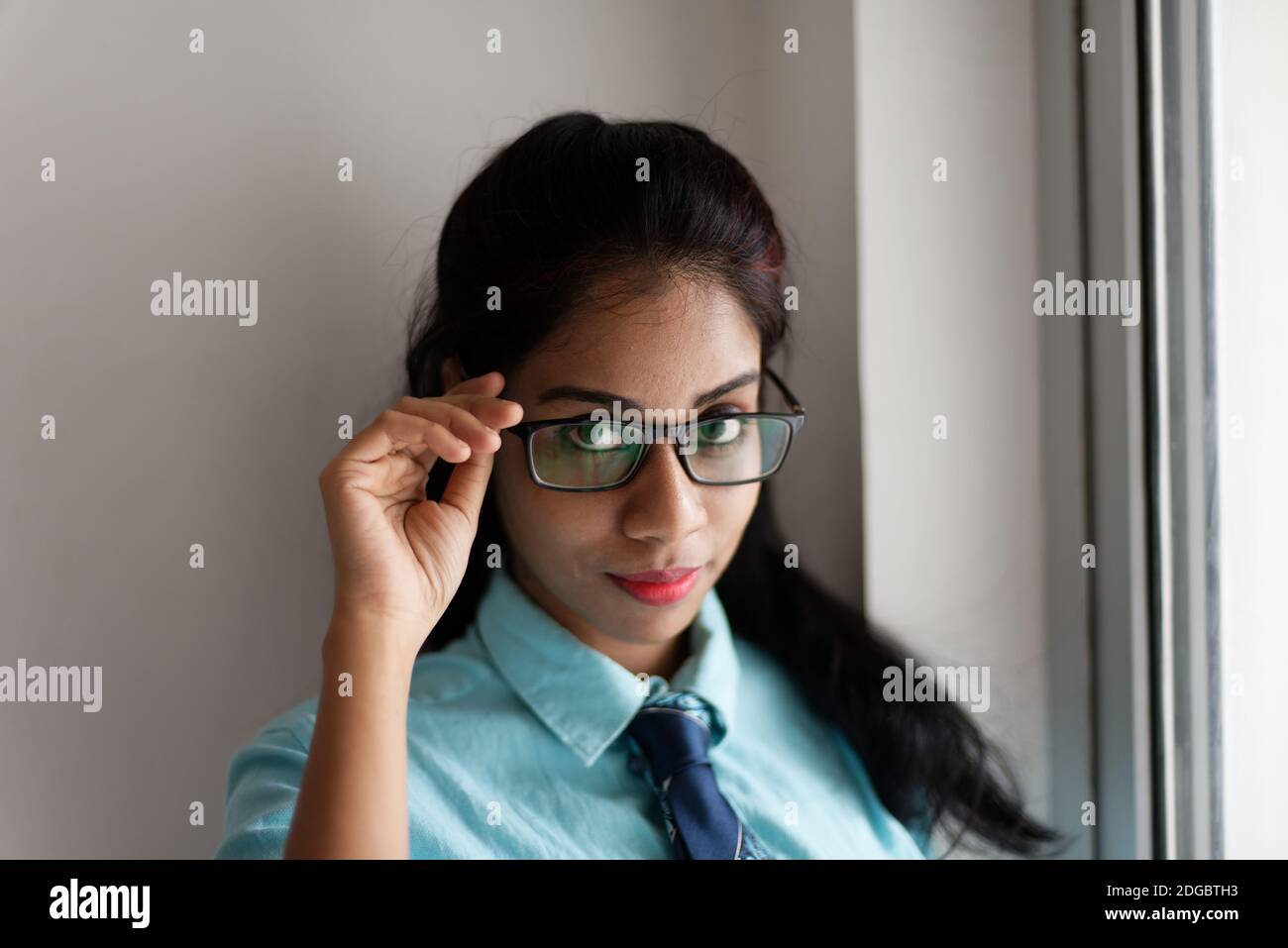 Indian Bengali attractive young woman in office wear standing