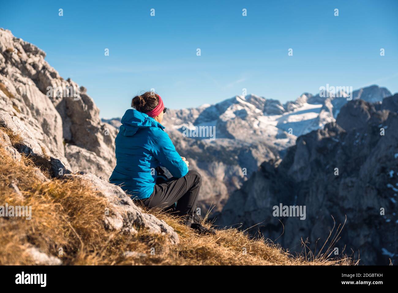 Woman looking at alpine landscape in autumn, Filzmoos, Salzburg, Austria Stock Photo
