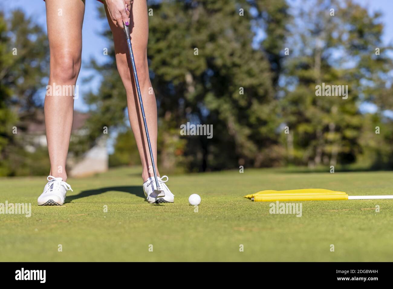 Lovely Blonde Female Golfter Enjoying A Round Of Golf On A Public Golf Course Stock Photo