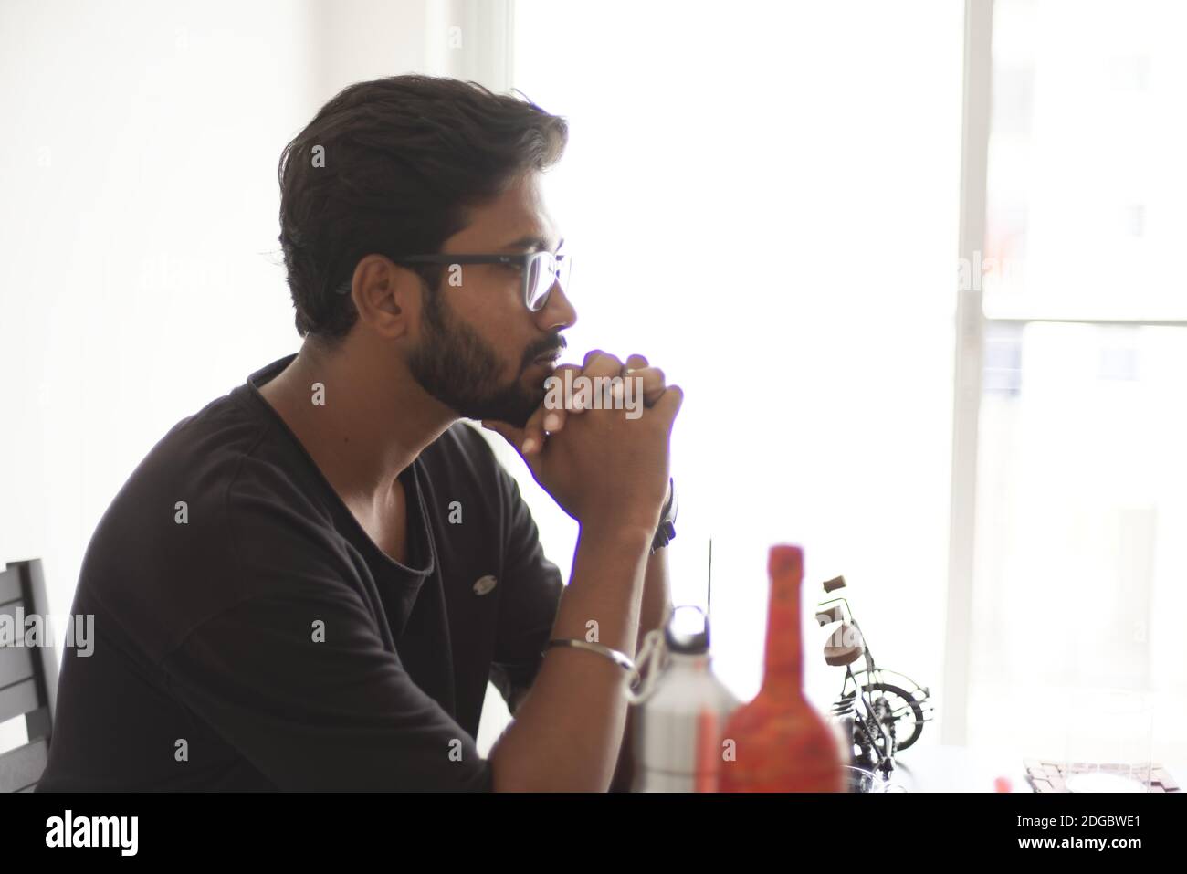 An Indian Bengali tall, dark, handsome beard young man in