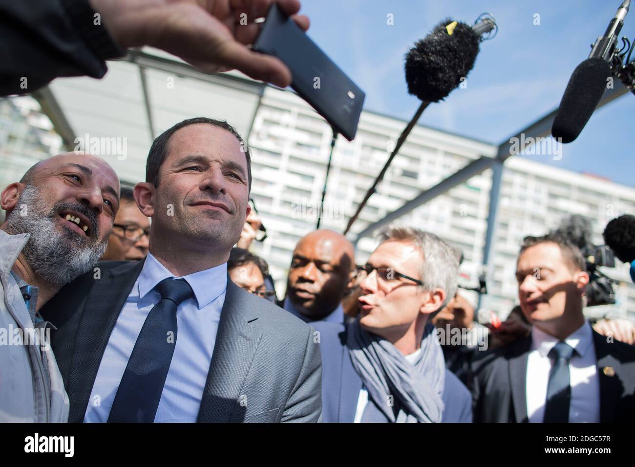 Presidential election candidate for the left-wing French Socialist (PS) party Benoit Hamon poses for a picture taken with a mobile phone with an inhabitant during a visit at the Cerisaie-Derriere-Les-Murs neighbourhood under renovation, in Villiers-le-Bel, on April 12, 2017. Photo by Eliot Blondet/ABACAPRESS.COM Stock Photo