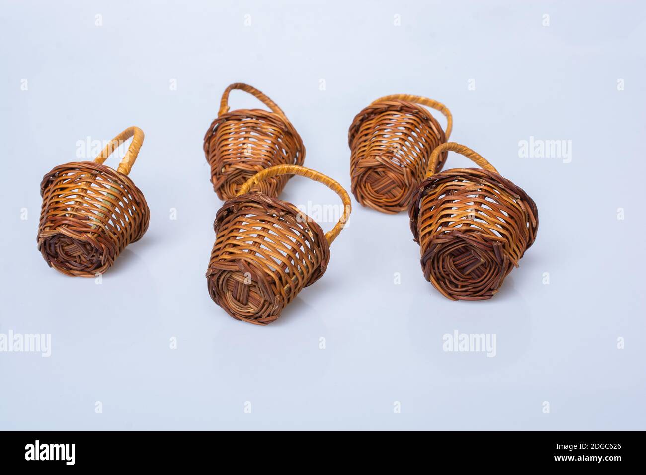 Little size Empty wicker baskets on white background Stock Photo - Alamy