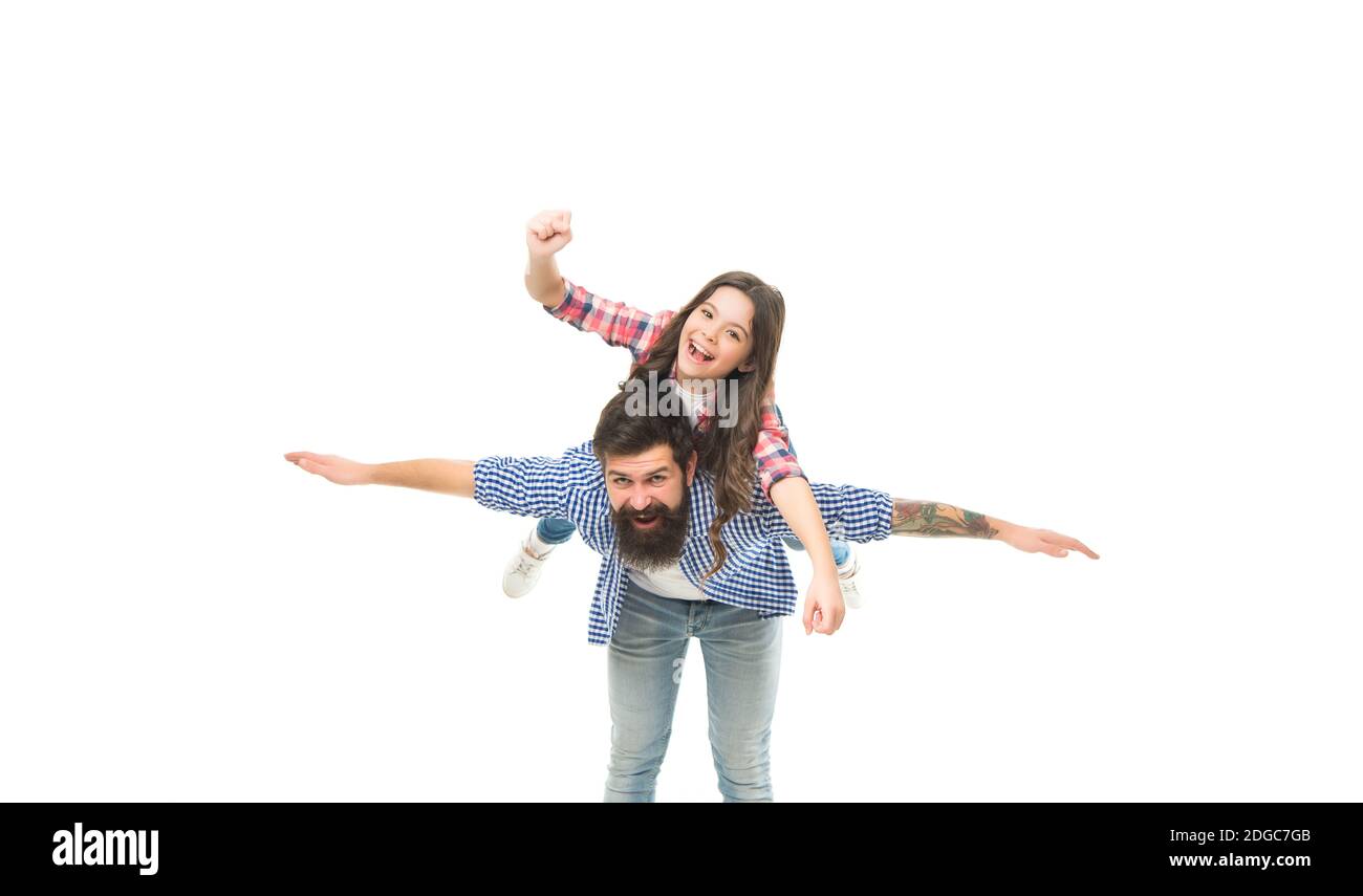 Just play, enjoy flight. Small child and bearded man playing pilots. Happy family enjoy playing together. Photo studio. Playing airplane game. Air travel. Playtime and leisure. Playing and having fun. Stock Photo