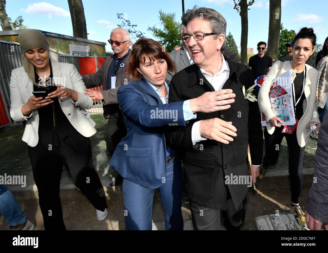 Presidential election candidate for the leftist coalition La France  Insoumise Jean-Luc Melenchon along with PR manager Sophia Chikirou (R)  greets supporters during a campaign rally at the Prairie de Filtres park in