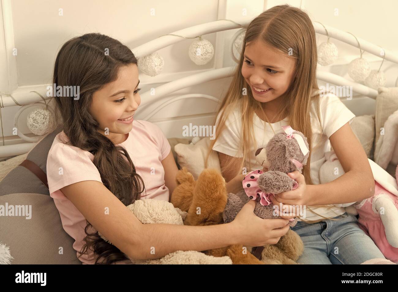 Lets play. Little children play toys in bedroom. Enjoying happy childhood. Childhood happiness. Childhood years. Playtime. Childhood and girlhood. Family life. Stock Photo