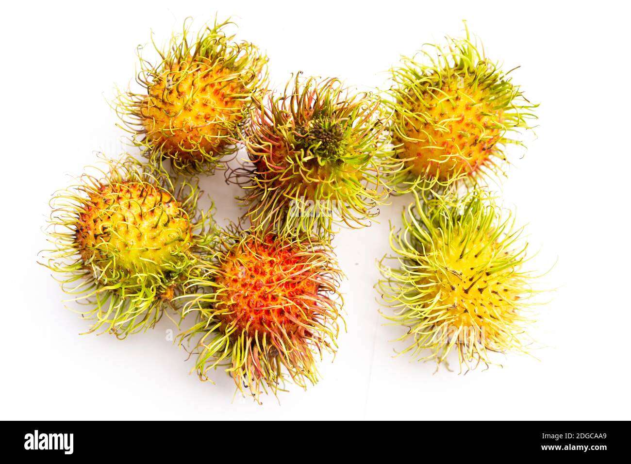 Fresh rambutan set of Asian fruits with mustaches lying on a white background Stock Photo