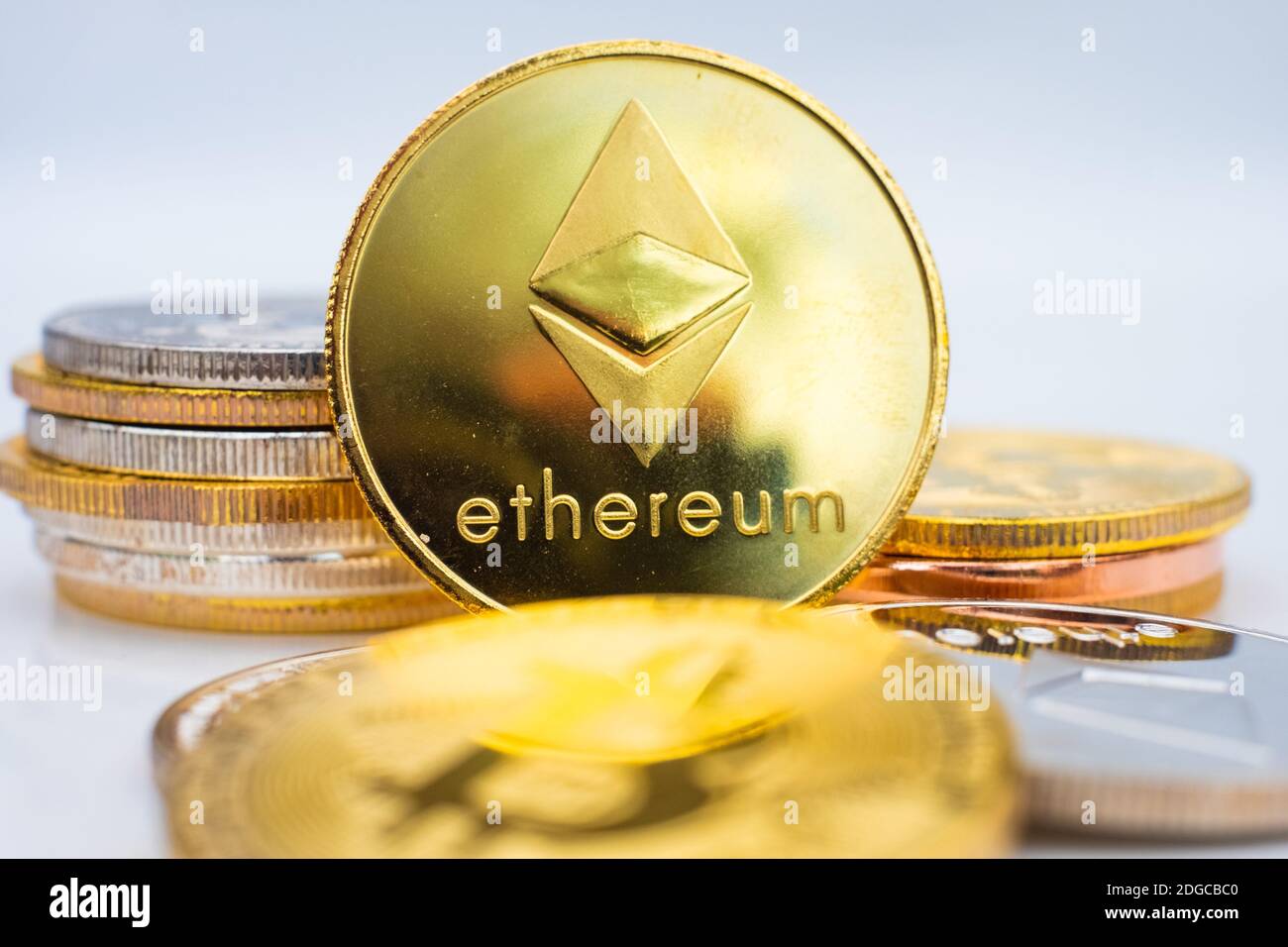 Gold crypto coins Ethereum ETH, paper denominations of Russian rubles.  Metal coins are laid out in a smooth background to each other, close-up  view fr Stock Photo - Alamy