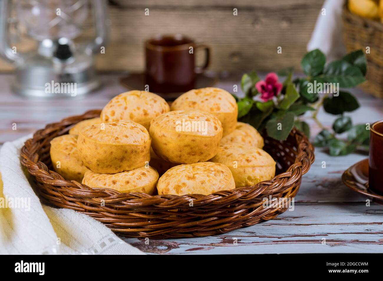 Cheese bread, chipa with coffee and flowers. Stock Photo
