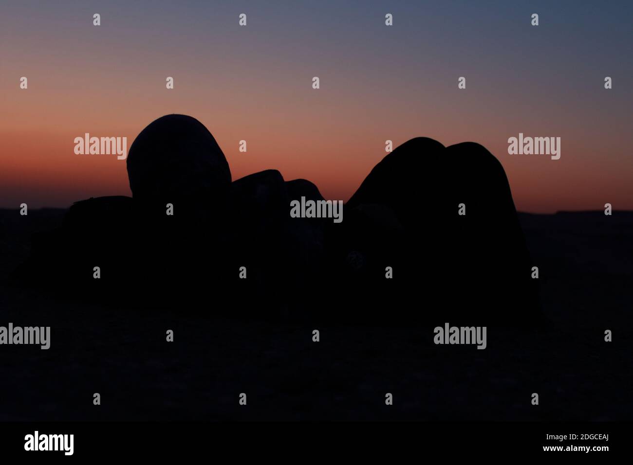 Woman watching sunset in desert hi-res stock photography and images - Alamy