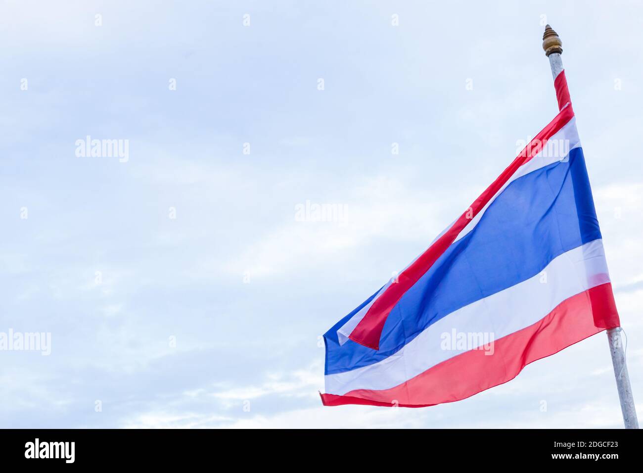Thailand flag red, white and blue stripes against a bright sky Stock Photo