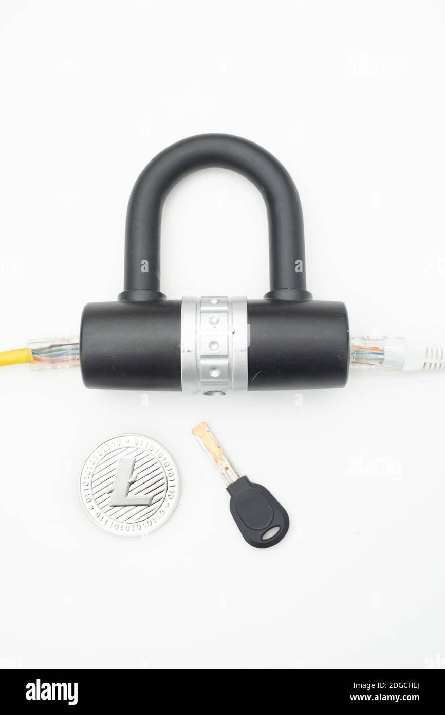 Two computer network cables going through a lock with a key and a ...