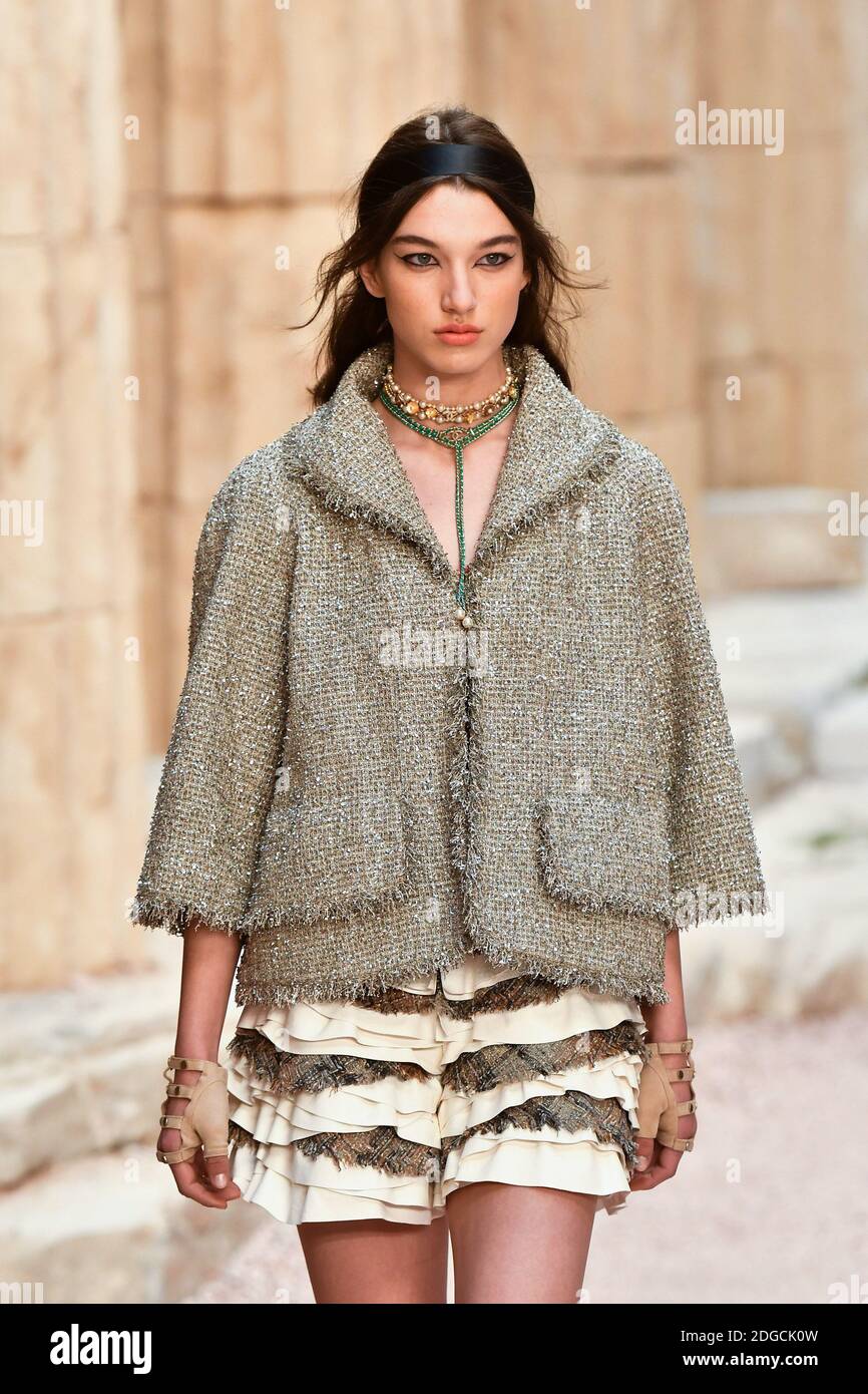 A model walk the runway during the Chanel Cruise 2017/2018