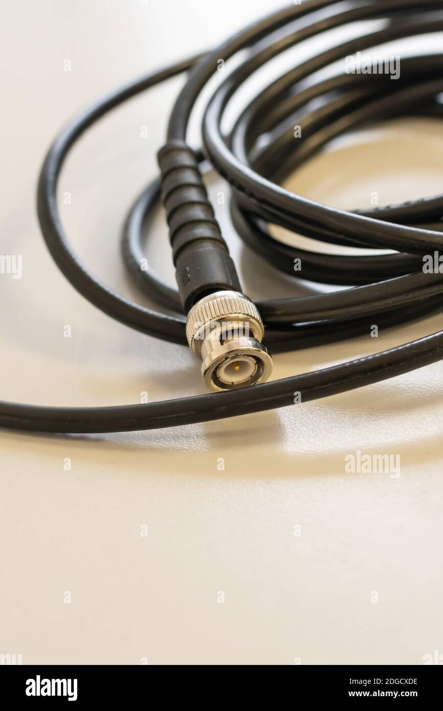 Black coaxial cable for signal transmission to set up cable television Stock Photo
