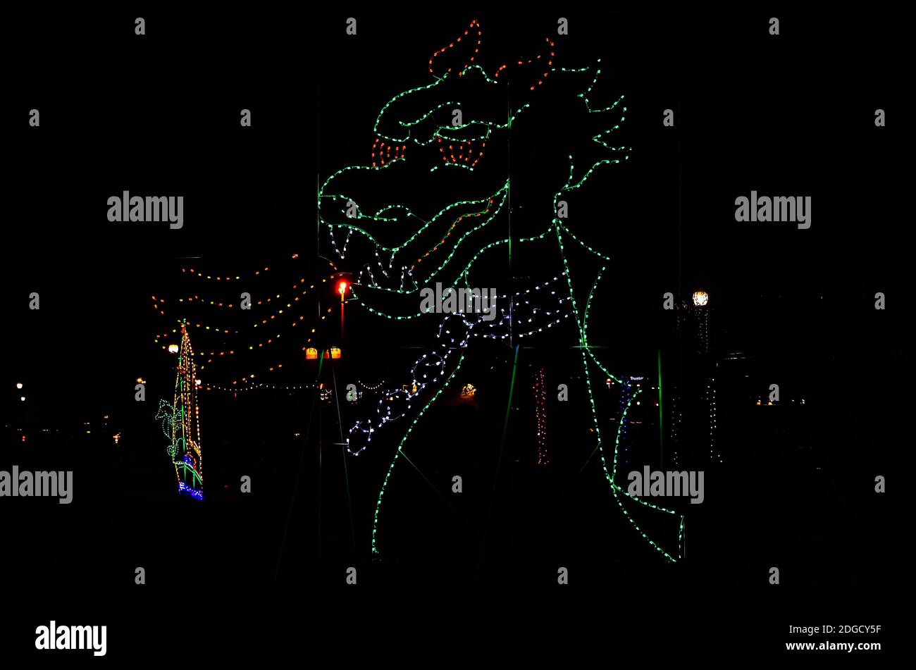 Christmas lights depict a dragon sea monster during a holiday